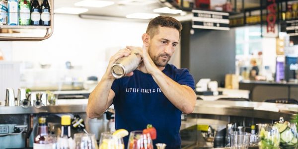 Photo of bartender using cocktail shaker
